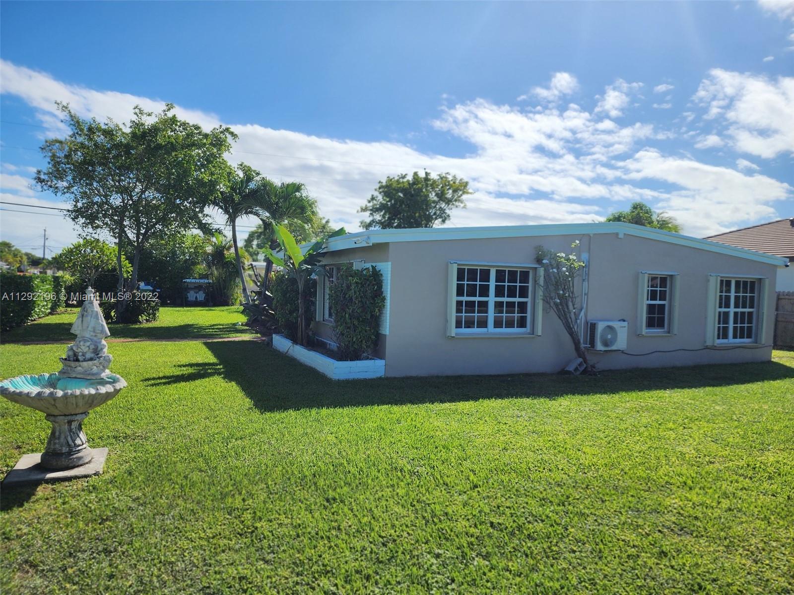 Tropical Estates Miami, FL 33165 - Photo 31 of 31 a view of a house with a yard