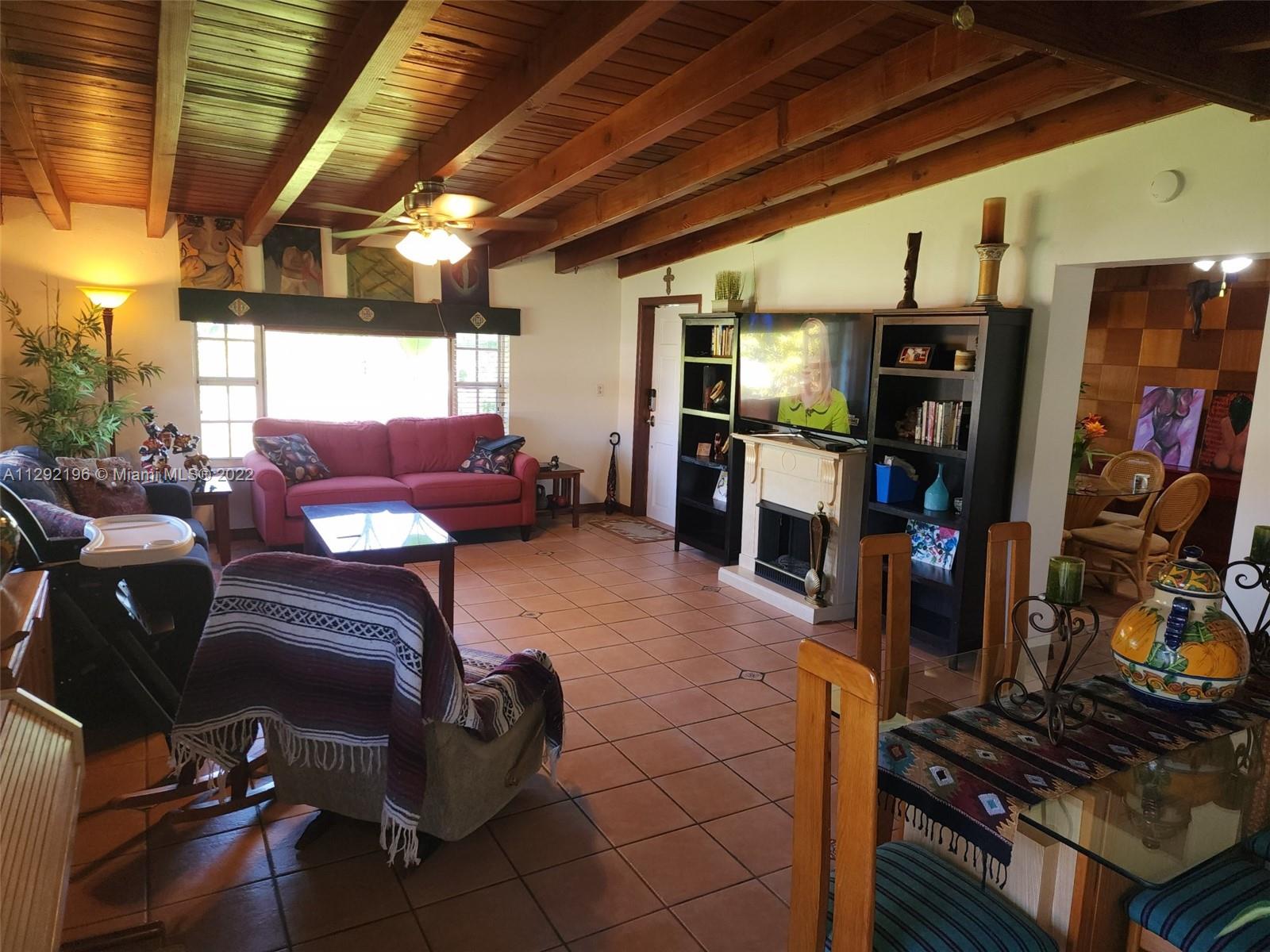 Tropical Estates Miami, FL 33165 - Photo 5 of 31 a living room with furniture and a flat screen tv