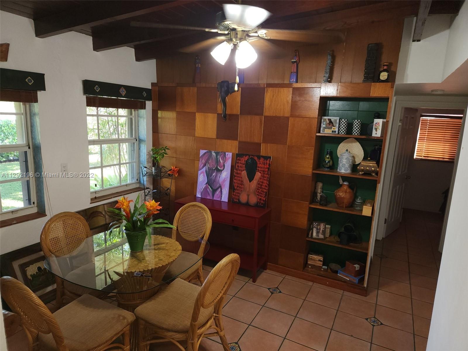 Tropical Estates Miami, FL 33165 - Photo 7 of 31 a living room with furniture a dining table and chairs
