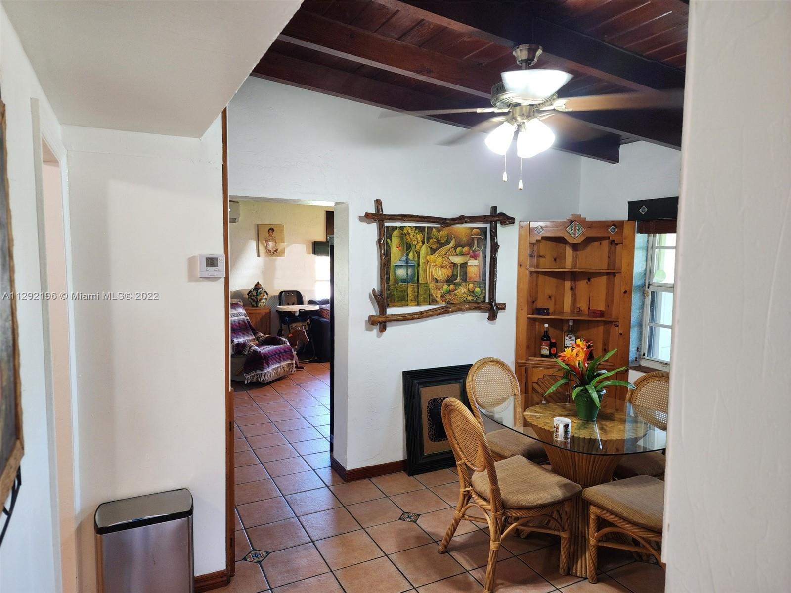 Tropical Estates Miami, FL 33165 - Photo 10 of 31 a view of a livingroom with furniture and a ceiling fan