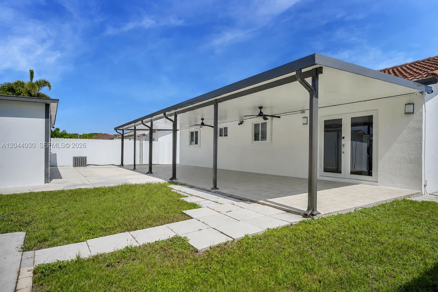 12551 Southwest 223rd Street Miami, FL 33170 - Photo 23 of 35 a view of house with garden