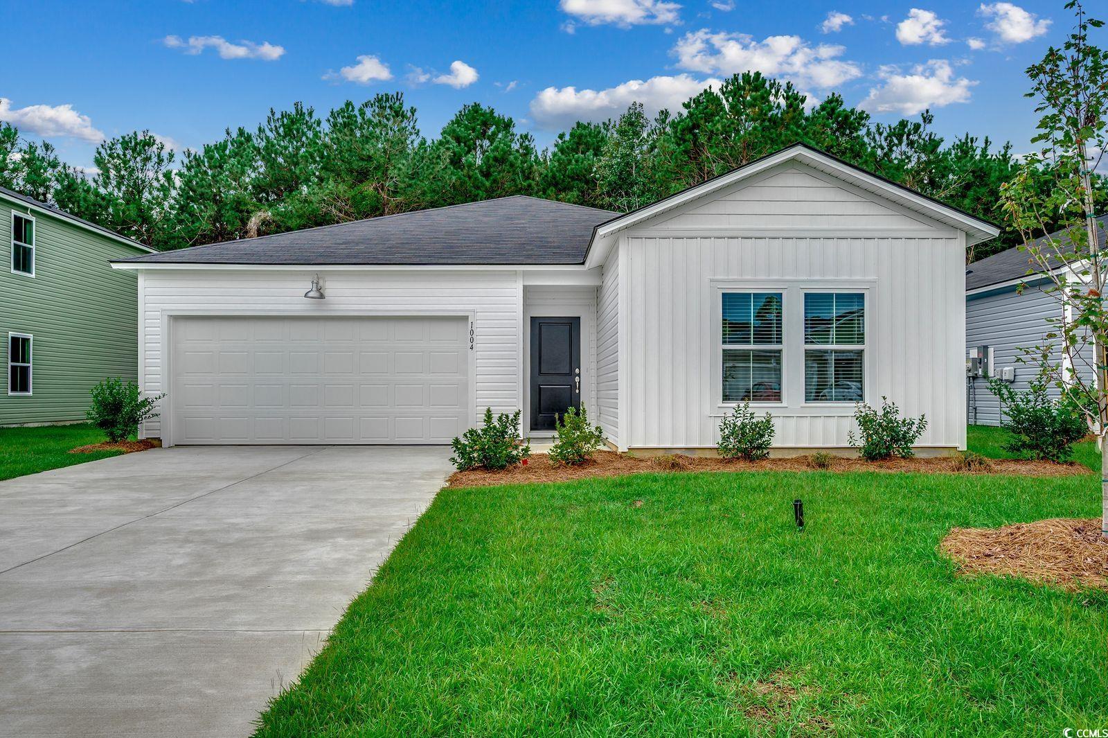 1004 Sentinel Court Little River, SC 29566 - Photo 1 of 31 Ranch-style house with a garage, board and batten siding, a front lawn, and concrete driveway