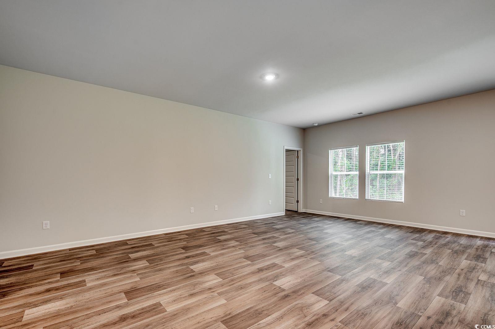 1004 Sentinel Court Little River, SC 29566 - Photo 9 of 31 Spare room with light wood-style flooring and baseboards