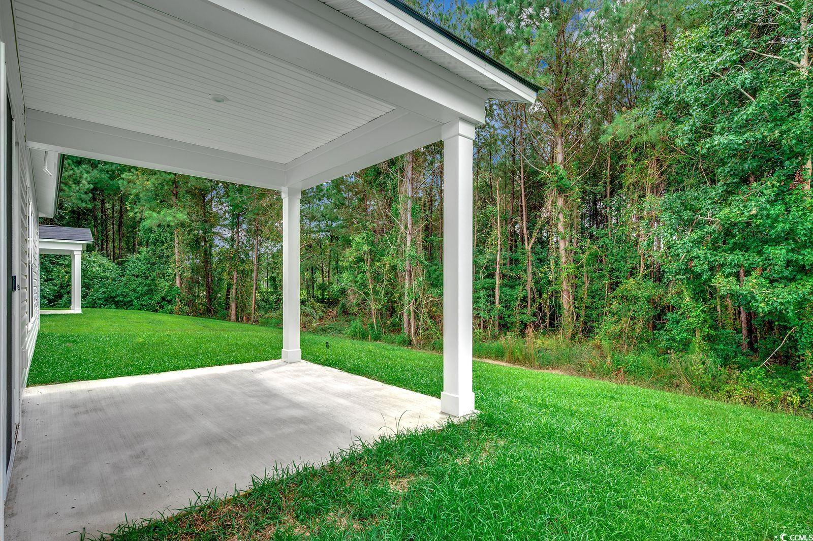 1004 Sentinel Court Little River, SC 29566 - Photo 11 of 31 View of green lawn with a patio area
