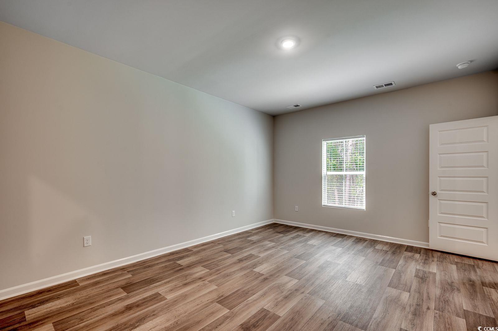 1004 Sentinel Court Little River, SC 29566 - Photo 12 of 31 Spare room featuring light wood finished floors