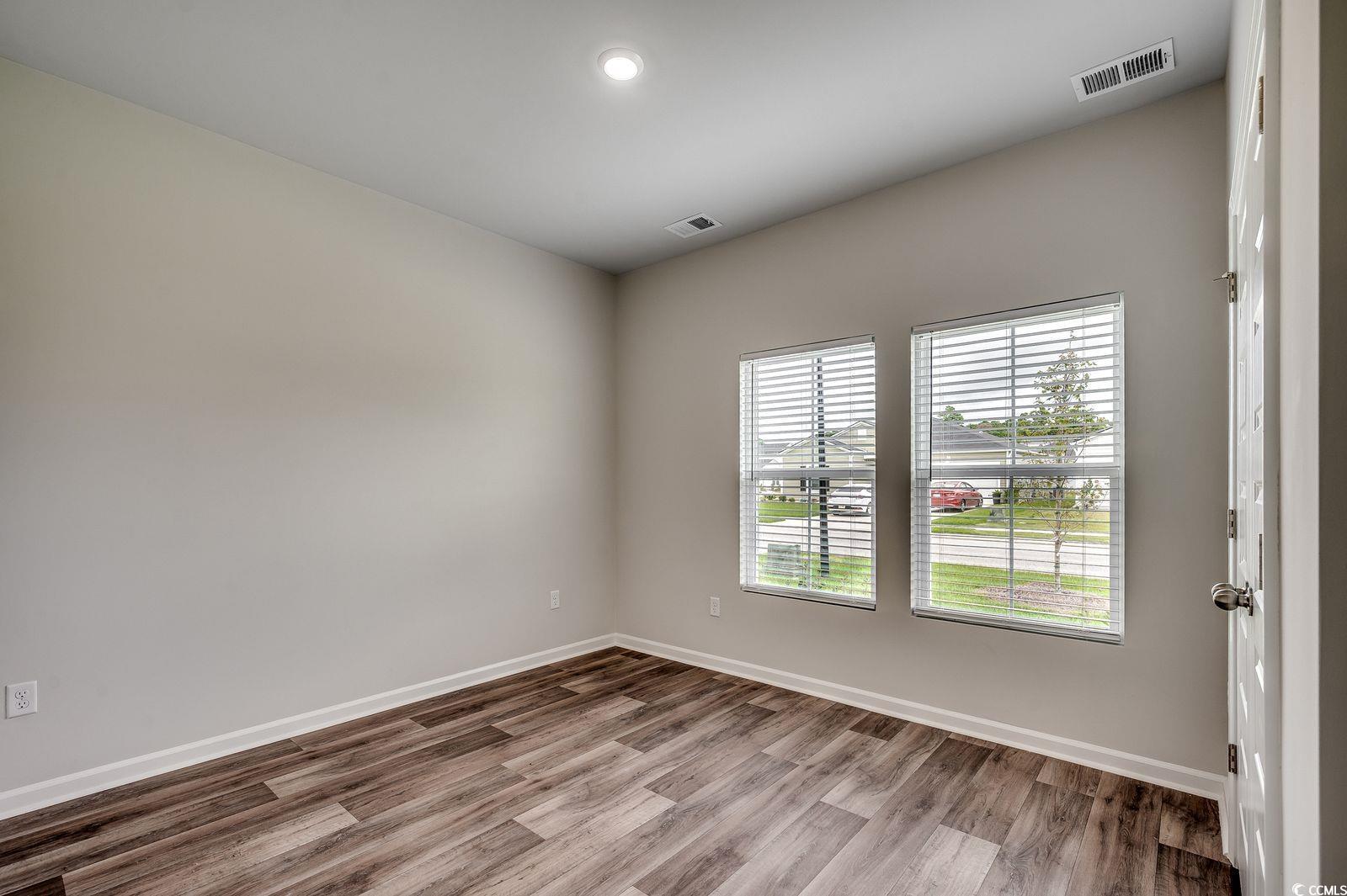 1004 Sentinel Court Little River, SC 29566 - Photo 17 of 31 Empty room with light wood-style floors and recessed lighting
