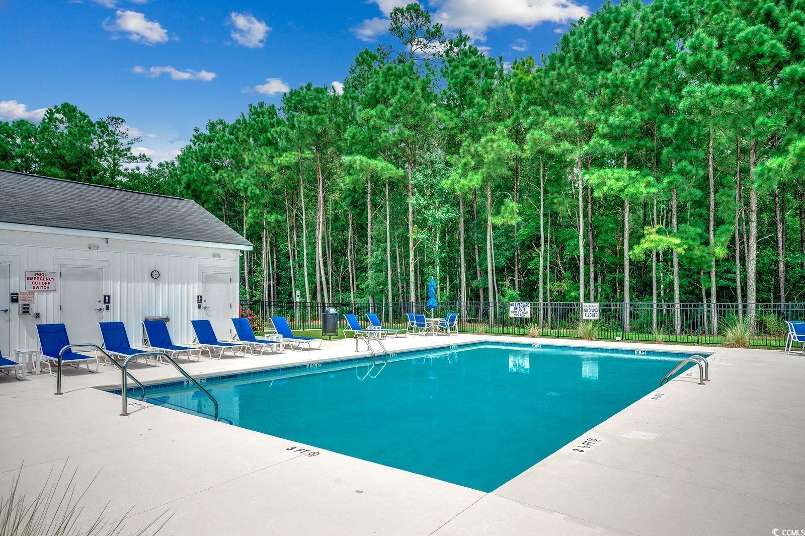 1004 Sentinel Court Little River, SC 29566 - Photo 24 of 31 Community pool featuring a patio area