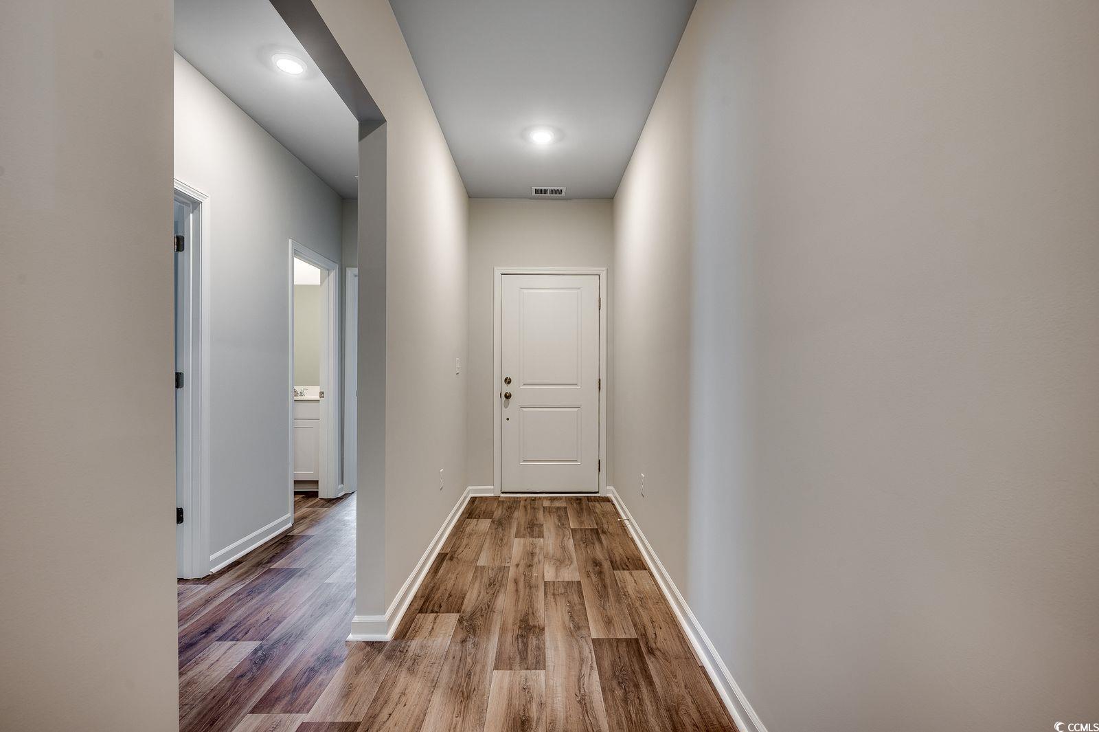 1004 Sentinel Court Little River, SC 29566 - Photo 3 of 31 Hallway featuring light wood finished floors and recessed lighting
