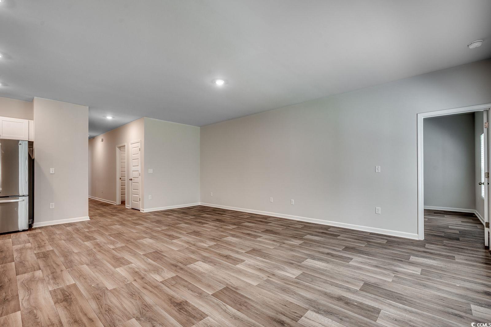 1004 Sentinel Court Little River, SC 29566 - Photo 8 of 31 Unfurnished living room featuring light wood-style flooring and recessed lighting