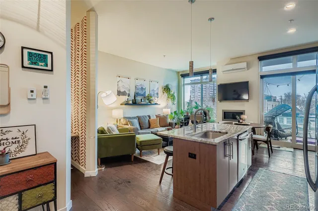a view of kitchen island with stainless steel appliances granite countertop lots of counter top space