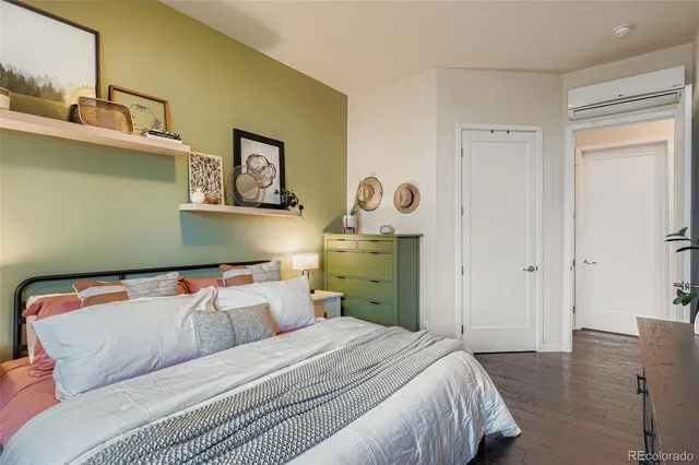 a bedroom with a bed and cabinets