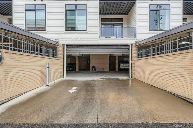 a view of a house with a parking space