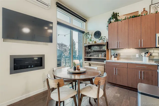 a kitchen with a dining table and chairs