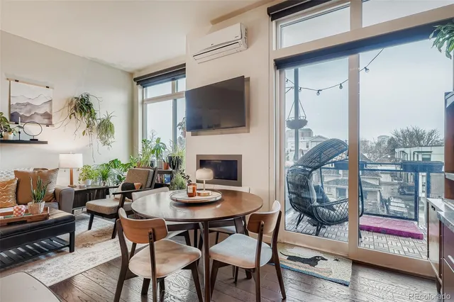 a outdoor living space with furniture and a flat screen tv