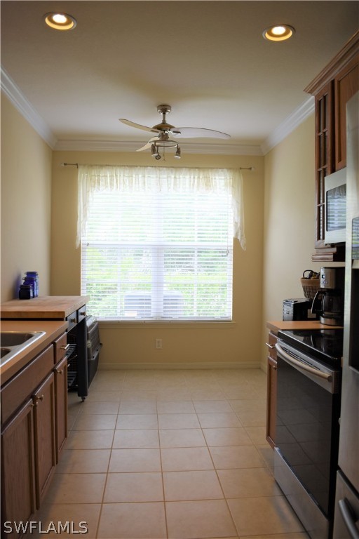4002 Cherrybrook Loop Fort Myers, FL 33966 - Photo 15 of 35 a kitchen with a stove a sink and a refrigerator