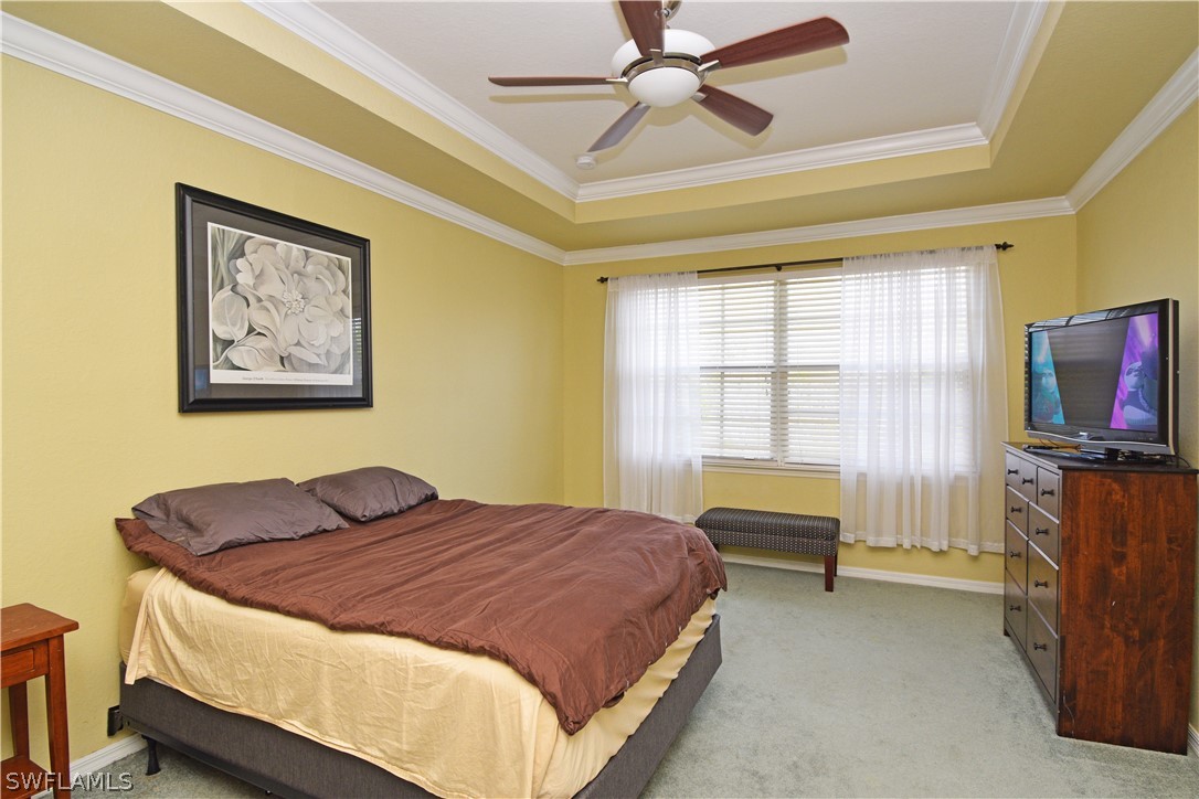 4002 Cherrybrook Loop Fort Myers, FL 33966 - Photo 20 of 35 a bedroom with a bed and a flat screen tv