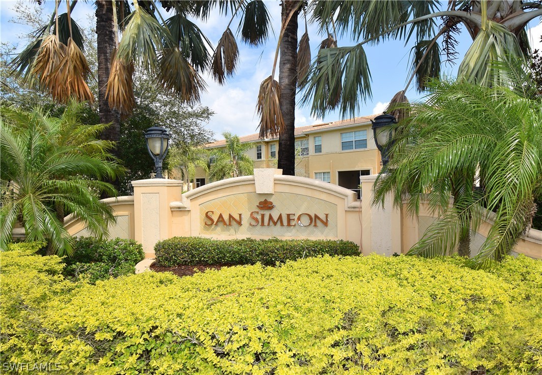 4002 Cherrybrook Loop Fort Myers, FL 33966 - Photo 30 of 35 a front view of multi story residential apartment building with yard and sign board