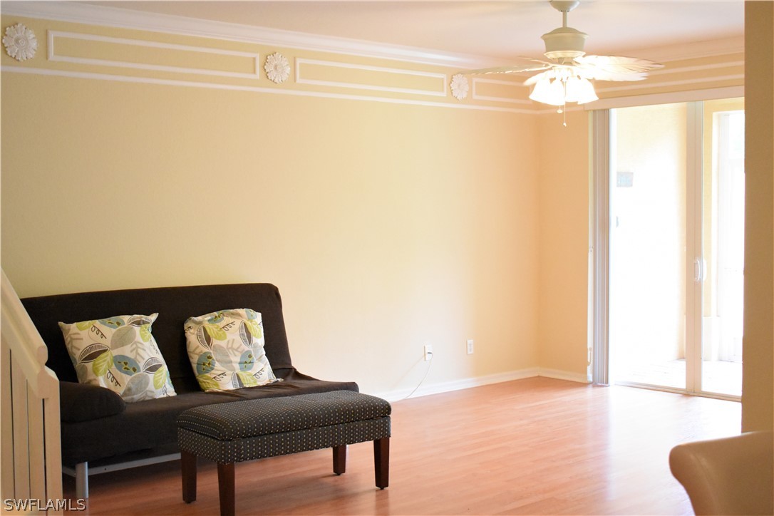 4002 Cherrybrook Loop Fort Myers, FL 33966 - Photo 6 of 35 a living room with furniture and a chandelier