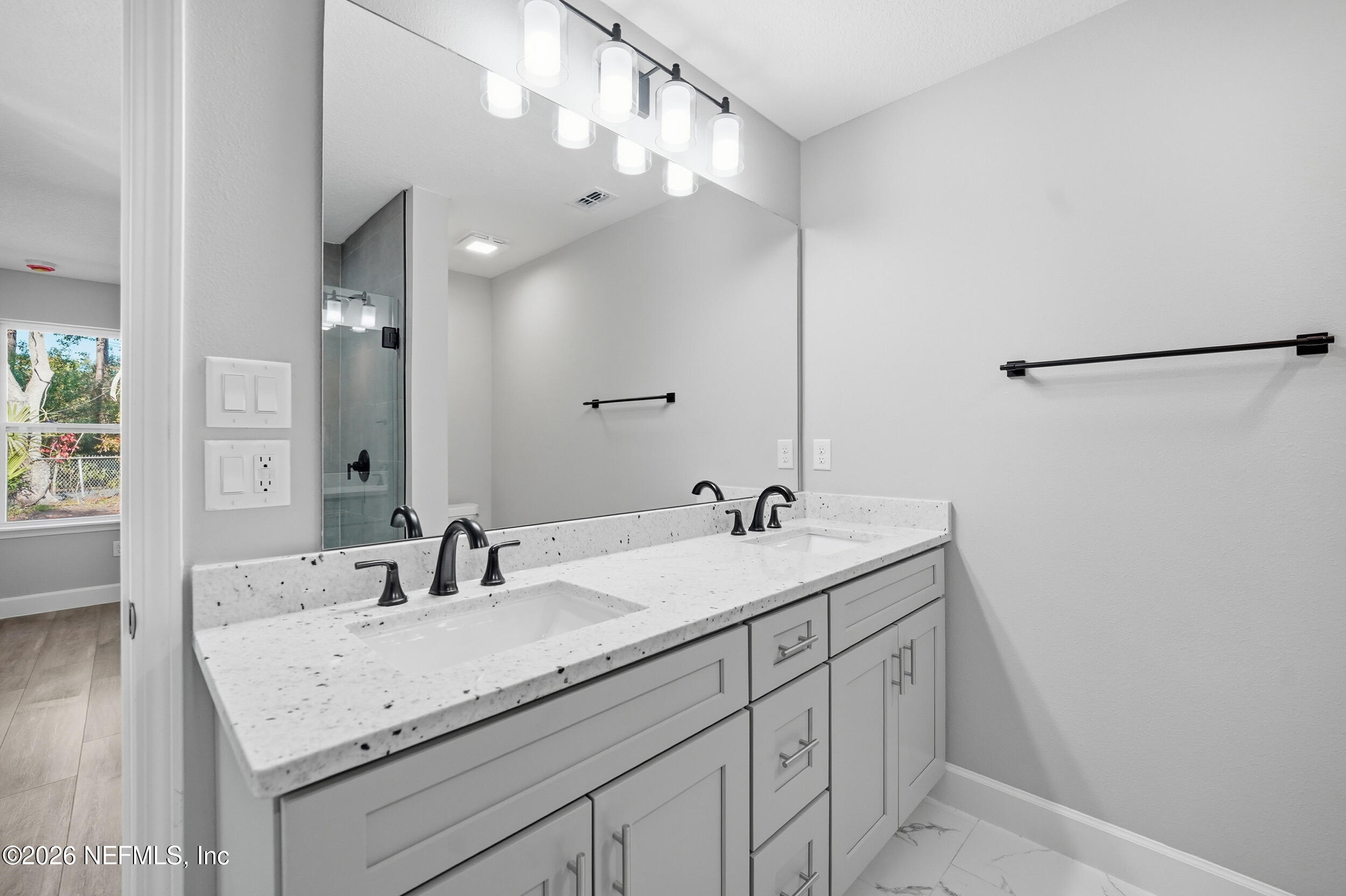 5259 Shenandoah Avenue Jacksonville, FL 32254 - Photo 15 of 51 a bathroom with a sink and a mirror