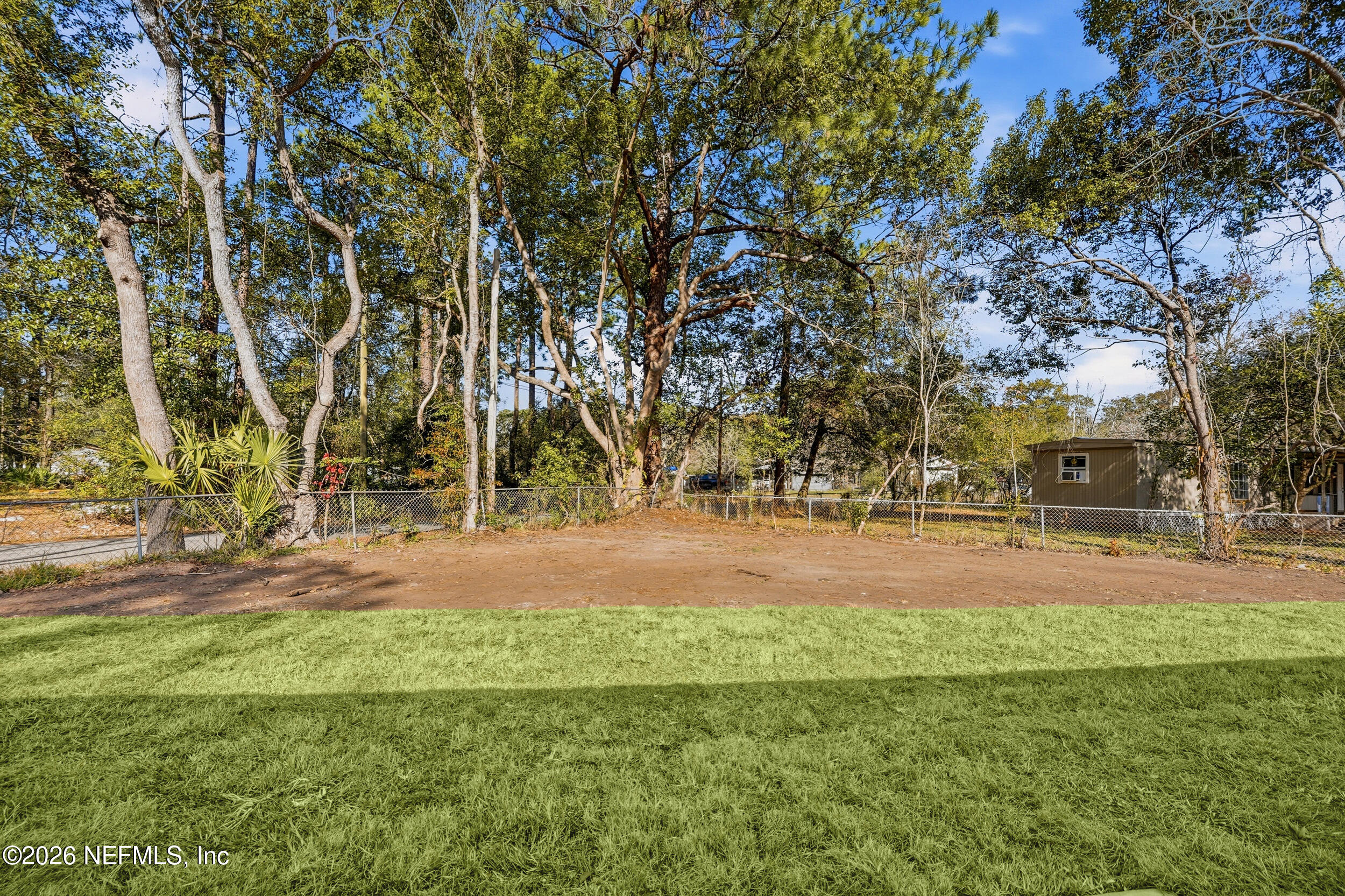 5259 Shenandoah Avenue Jacksonville, FL 32254 - Photo 25 of 51 a backyard of apartments with large trees