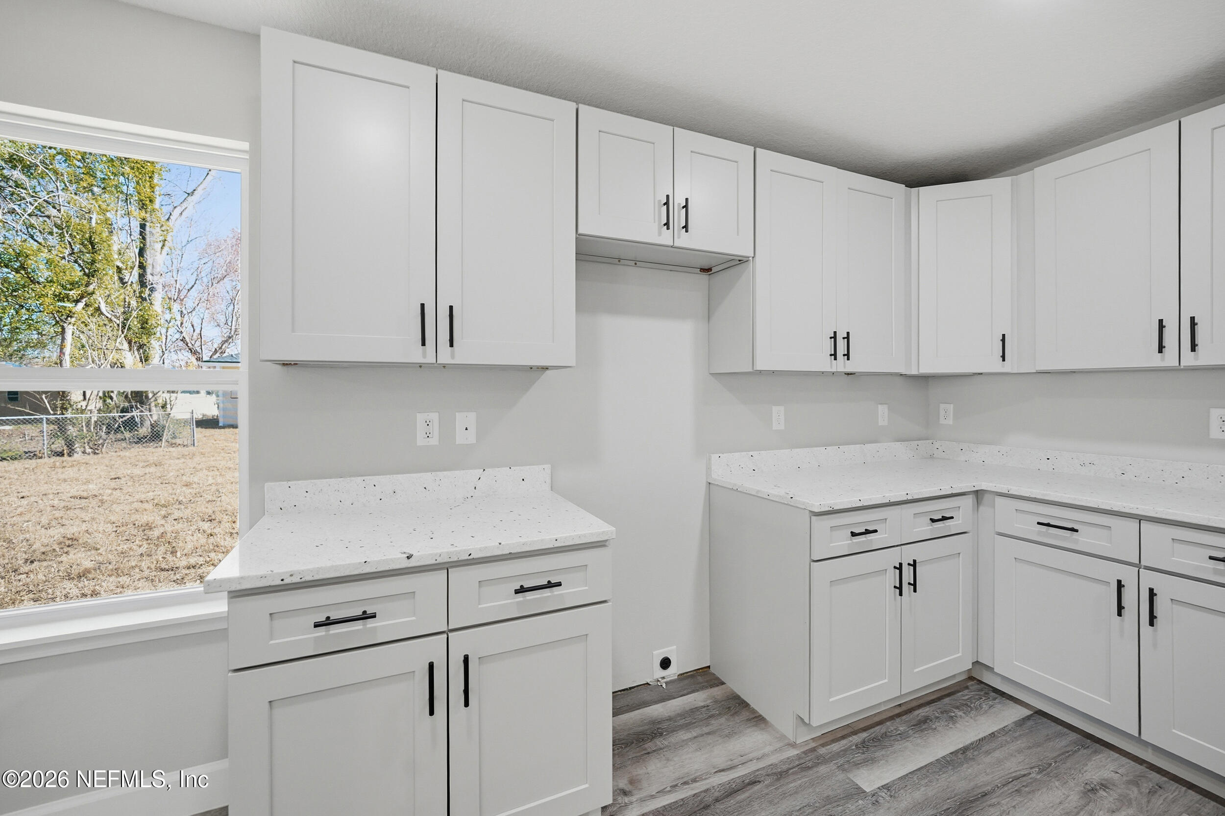 5259 Shenandoah Avenue Jacksonville, FL 32254 - Photo 8 of 51 a kitchen with white cabinets and white appliances