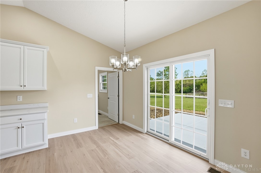 4600 Beal Road Franklin, OH 45005 - Photo 13 of 42 Bright dining area with easy outdoor access, ideal for gatherings and enjoying the view.