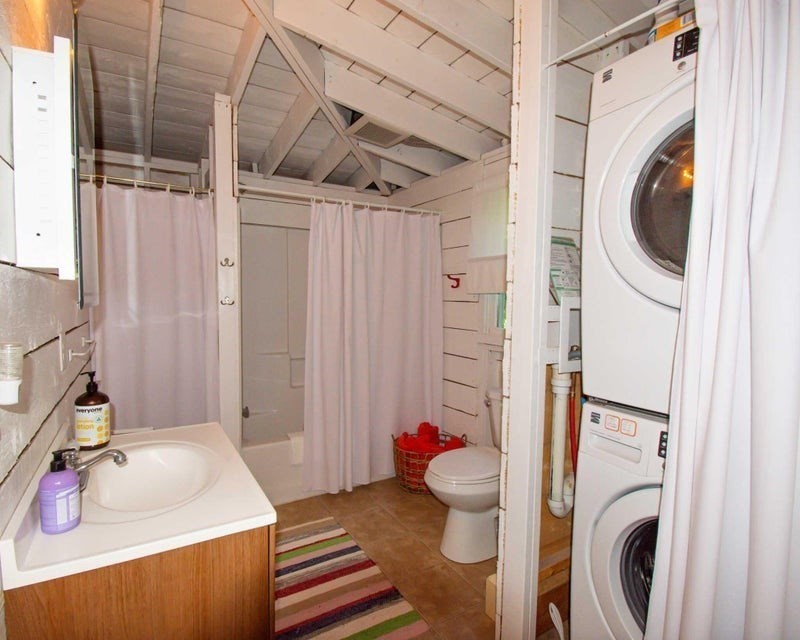 50 Mill Road Eastham, MA 02642 - Photo 14 of 26 a bathroom with a sink toilet and shower