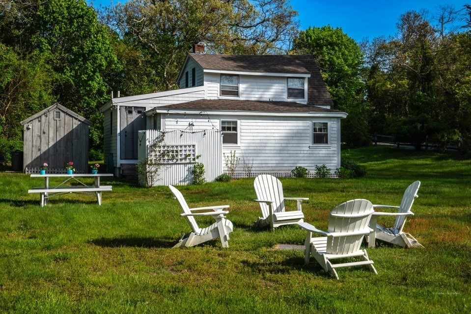 50 Mill Road Eastham, MA 02642 - Photo 2 of 26 a view of a house with a yard porch and sitting area