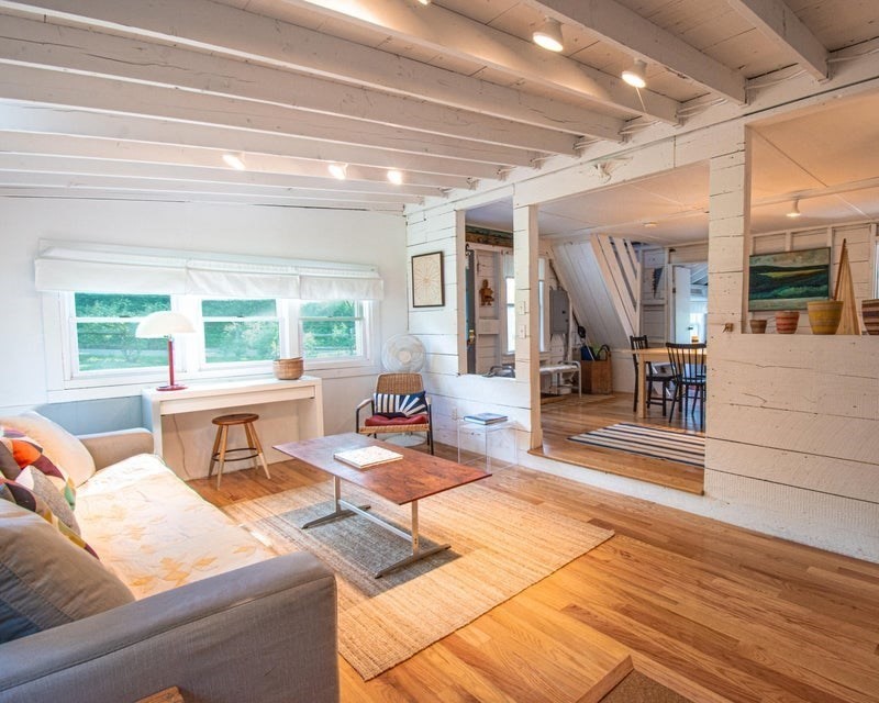 50 Mill Road Eastham, MA 02642 - Photo 6 of 26 a living room with furniture and a table