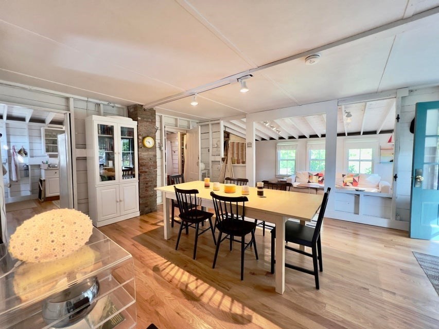 50 Mill Road Eastham, MA 02642 - Photo 8 of 26 a view of a dining room with furniture and wooden floor
