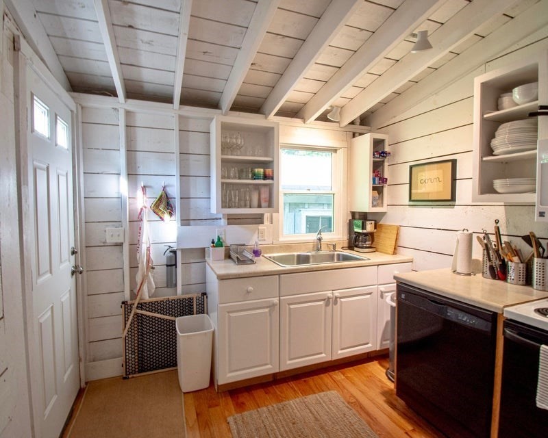 50 Mill Road Eastham, MA 02642 - Photo 10 of 26 a kitchen with cabinets a sink and appliances