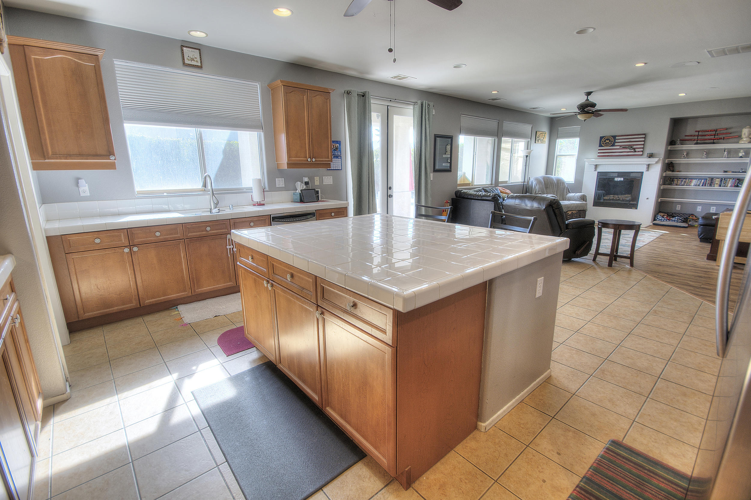 83387 Lightning Road Indio, CA 92203 - Photo 12 of 20 a kitchen with stainless steel appliances granite countertop a sink counter space cabinets and a large window