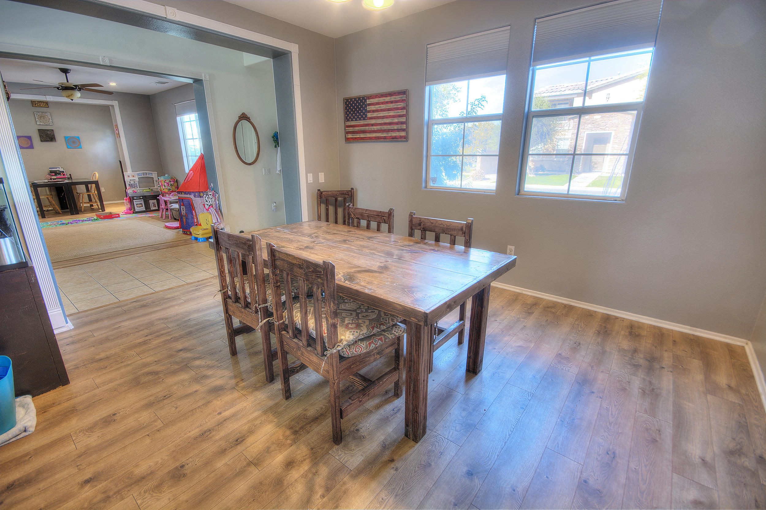 83387 Lightning Road Indio, CA 92203 - Photo 14 of 20 a view of a dining room with furniture and wooden floor