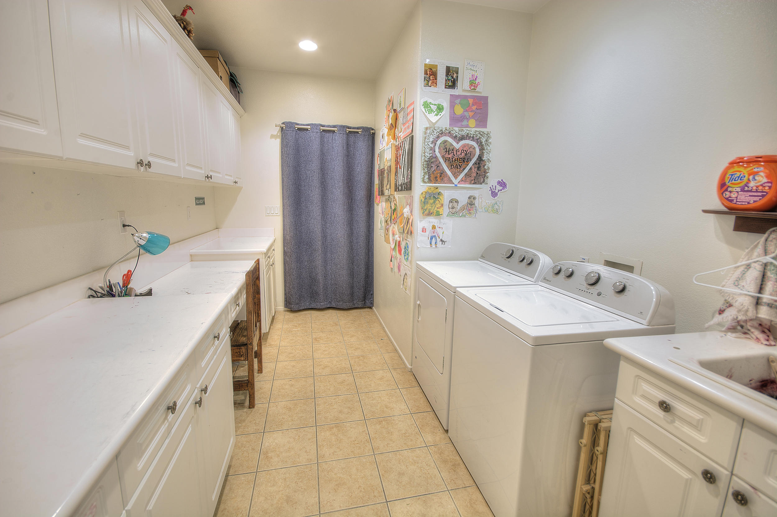 83387 Lightning Road Indio, CA 92203 - Photo 20 of 20 a storage room with a sink and wooden floor