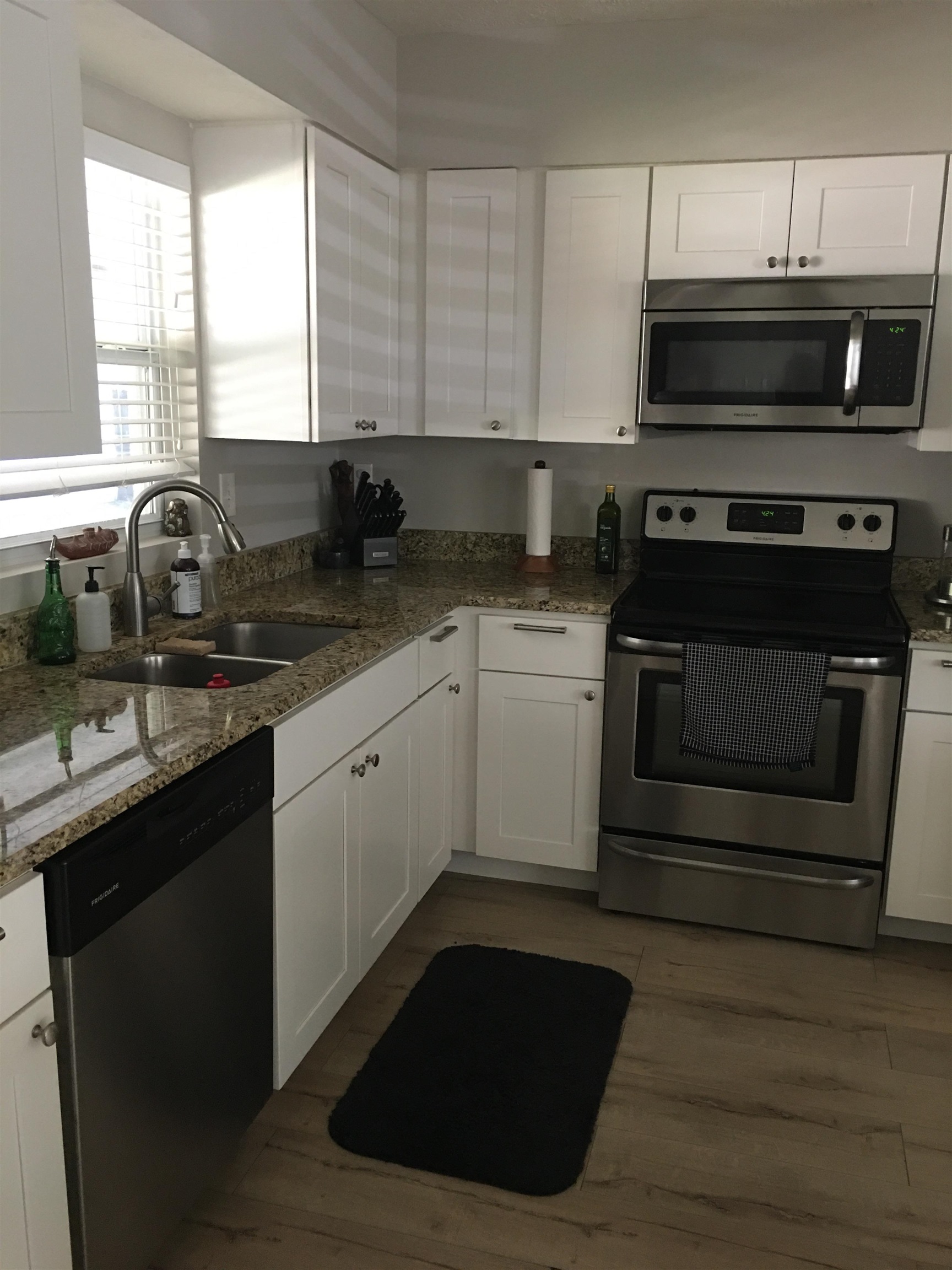 359 Jasmine Road St. Augustine, FL 32086 - Photo 8 of 33 a kitchen with stainless steel appliances a stove sink and cabinets