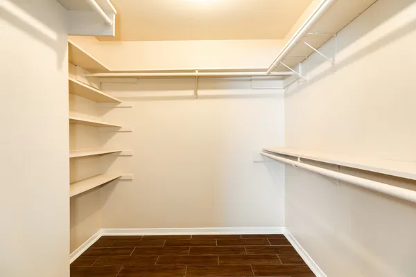 a view of an empty walk in closet