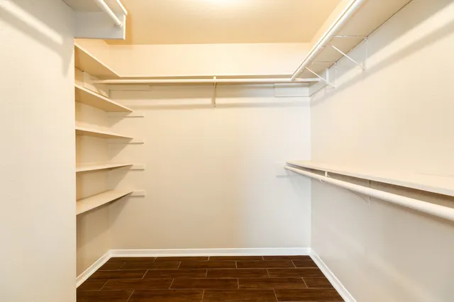 a view of an empty walk in closet