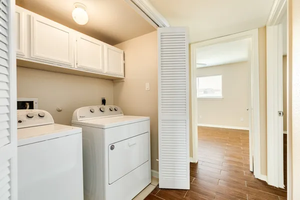 a view of storage and utility room with washer and dryer