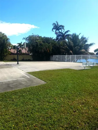 a view of swimming pool with outdoor seating