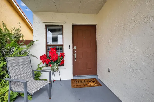 a house with a potted plant on it