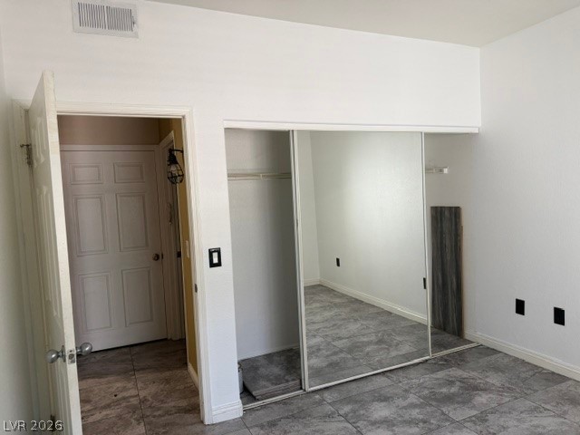 3318 North Decatur Boulevard, Unit 1163 Las Vegas, NV 89130 - Photo 30 of 35 Functional bedroom featuring a closet with mirrored sliding doors, perfect for any decorating style.