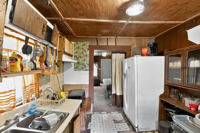 a bathroom with a sink mirror and vanity