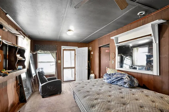 a bedroom with bed and a table