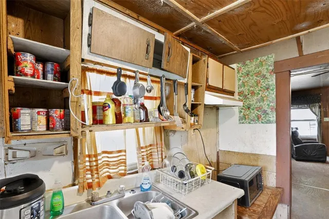 a balcony view with a potted plant on the side of a building