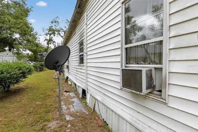 a view of yard with trees in the background