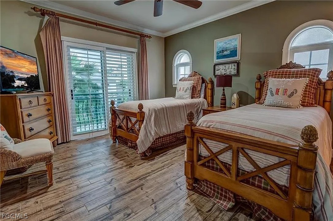 11551 Wightman Lane Captiva, FL 33924 - Photo 11 of 38 a bedroom with furniture and a window