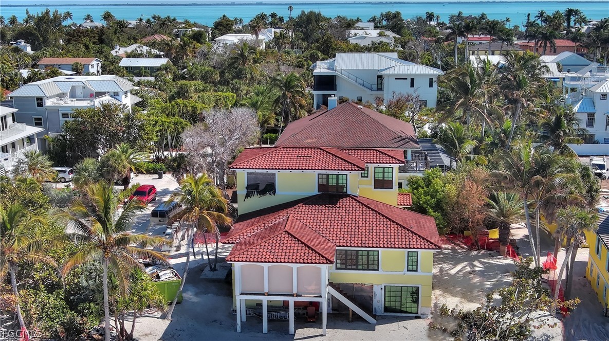 11551 Wightman Lane Captiva, FL 33924 - Photo 3 of 38 a aerial view of a house with yard and outdoor seating