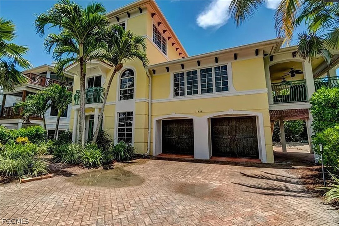11551 Wightman Lane Captiva, FL 33924 - Photo 5 of 38 a view of a house with a yard and plants