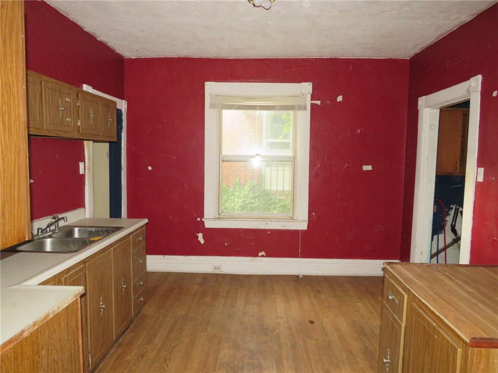 1465 Steuben Street Pittsburgh, PA 15205 - Photo 7 of 24 a view of a kitchen with a fridge and a window