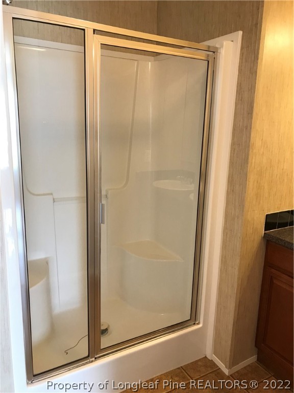 2995 Underwood Road Carthage, NC 28327 - Photo 23 of 40 a bathroom with a glass shower door